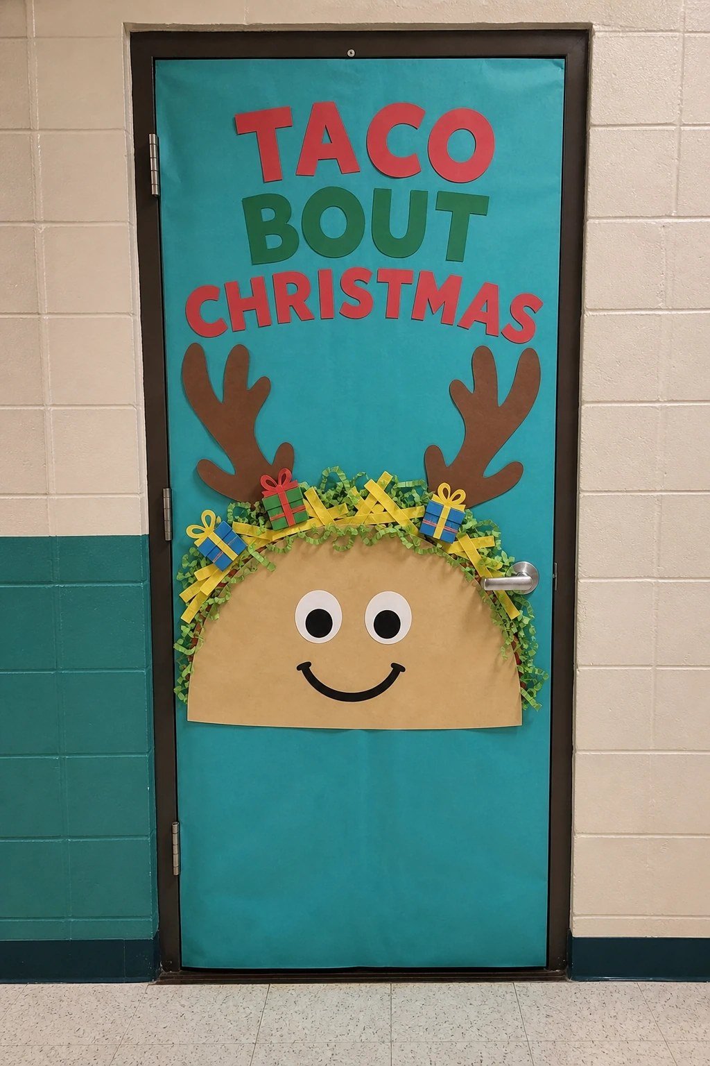 A classroom door with a giant paper taco wearing reindeer antlers