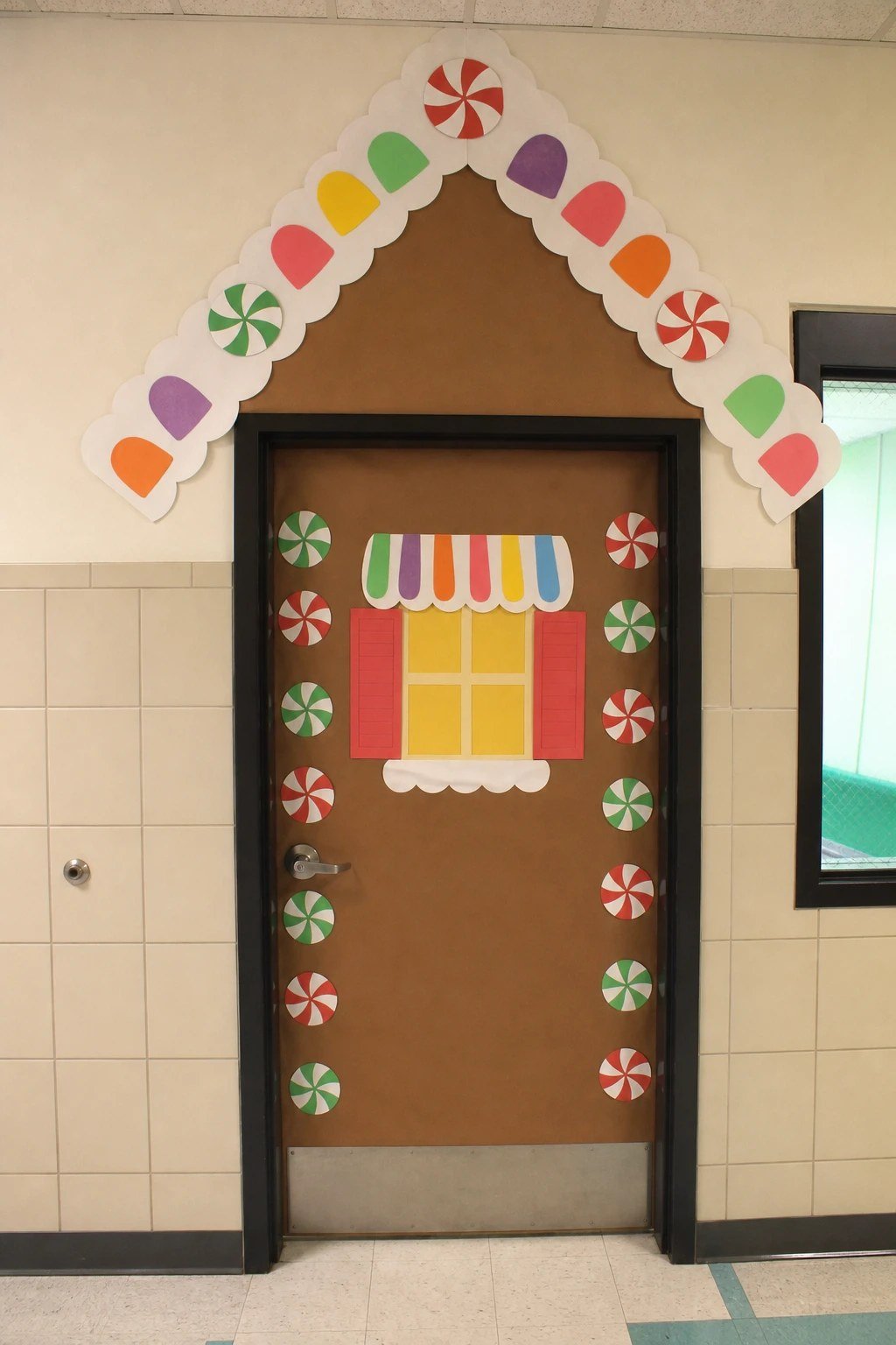 A gingerbread house door roof made with white scalloped border and paper gumdrops