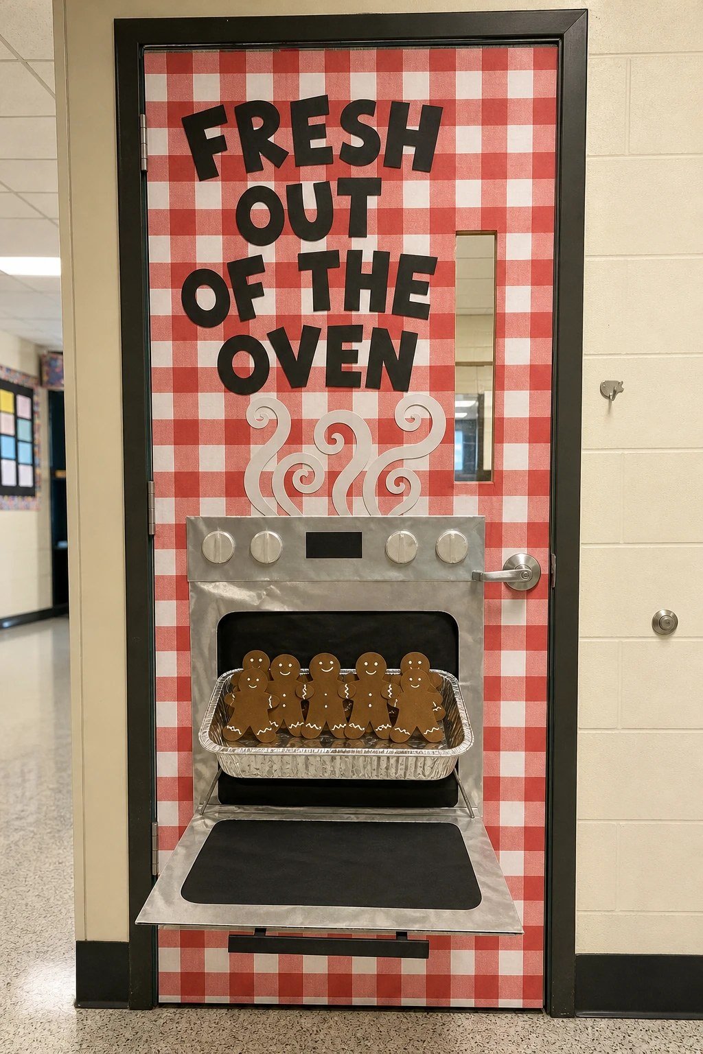 A classroom door with a paper oven and a tray of gingerbread friends